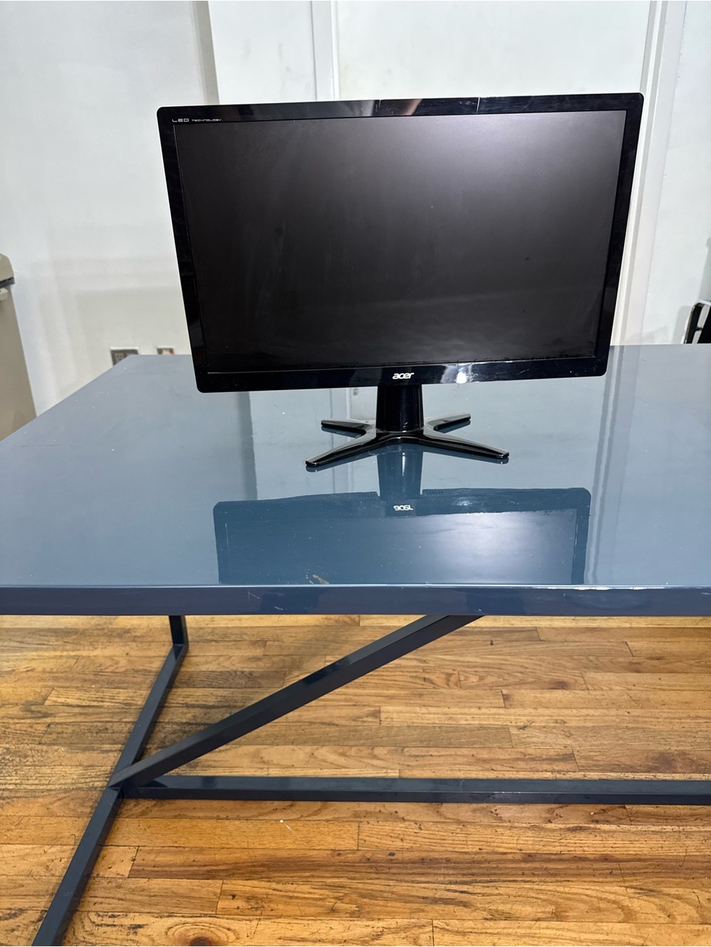 10 computer Black Display Monitors and a keyboard